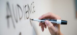 The word audience drawn on a whiteboard
