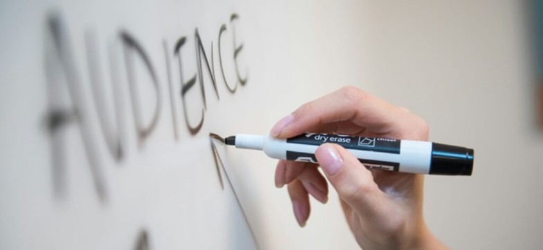 The word audience drawn on a whiteboard