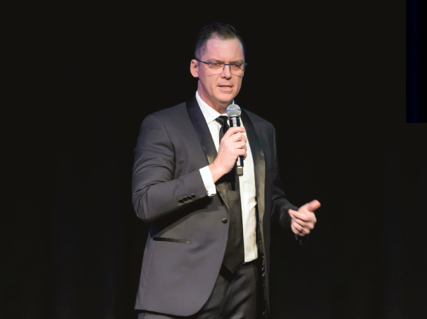 Brett Wiskar delivering a keynote on  how organisations can innovation, and adaptability. 