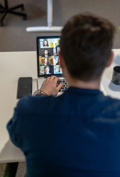 unsplash Photo by a Maximea Man in blue sweater using ipad for group meeting