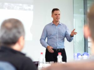 Brett Wiskar Speaking to an Executive Audience at a strategy off site retreat