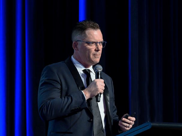 Brett Wiskar - delivering a keynote to a formal corporate event at the Brisbane Hilton